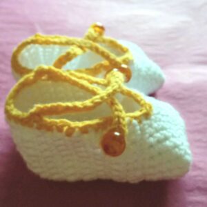 Yellow baby’s shoes